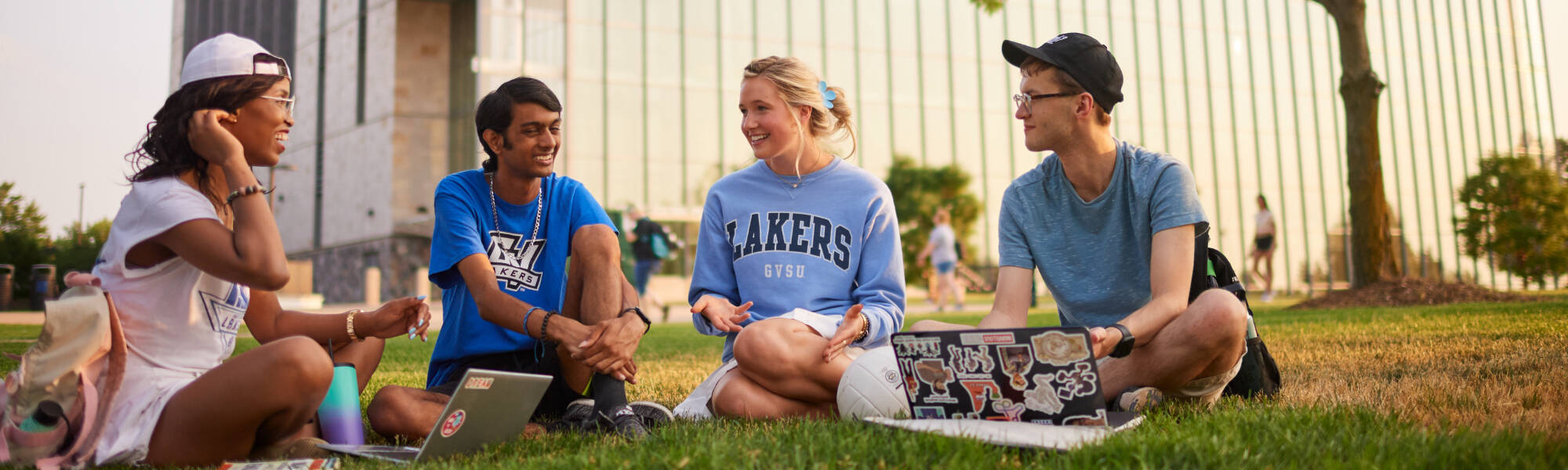 Students talking outside of the Mary Idema Pew Library on Grand Valley State University’s Allendale Campus.